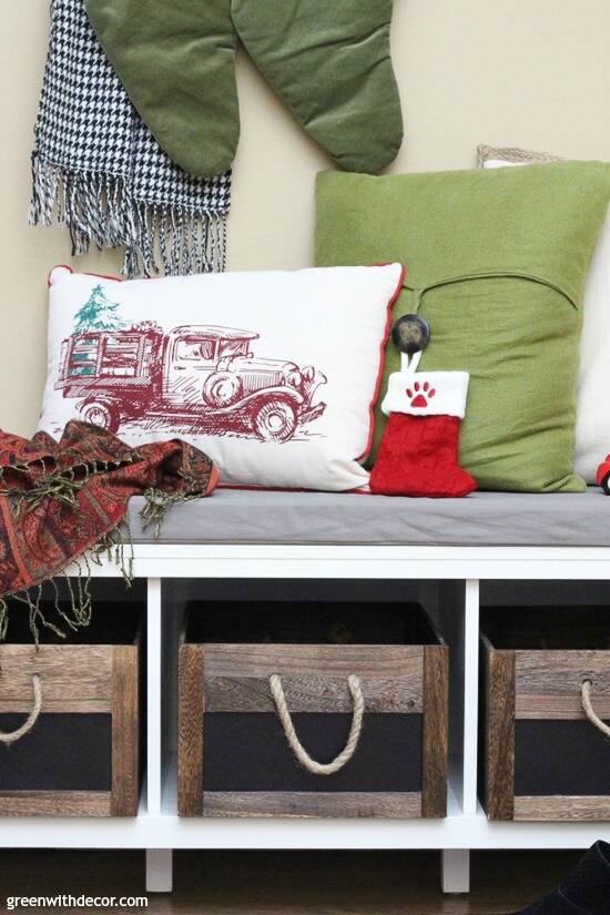 Christmas mudroom with wood and rope crates and holiday pillows