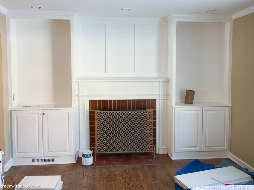 White built-in bookshelves around the fireplace - Green With Decor