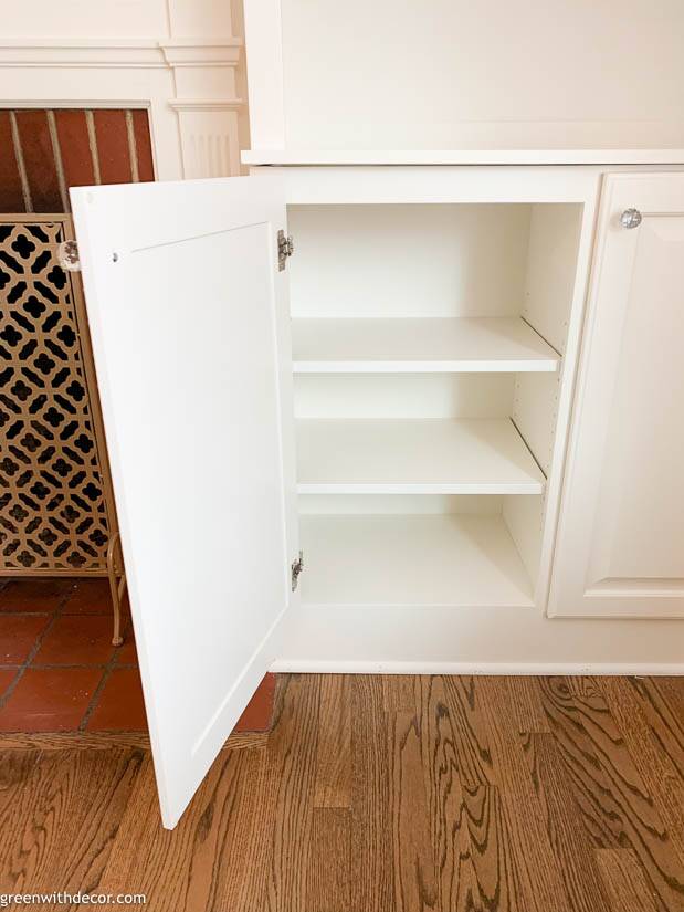 White built-in bookshelves around the fireplace - Green With Decor