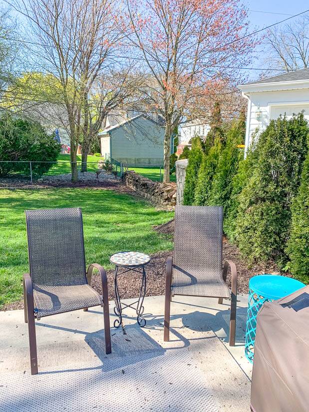 Backyard with two brown chairs