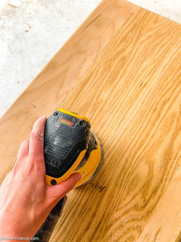 Sanding an end table before a furniture makeover