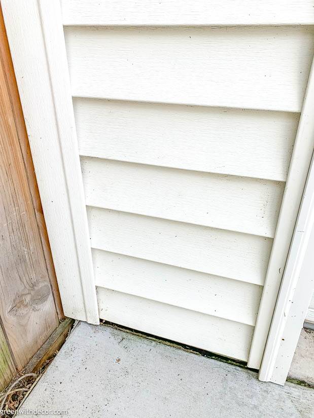 Garage siding before after cleaned with a pressure washer