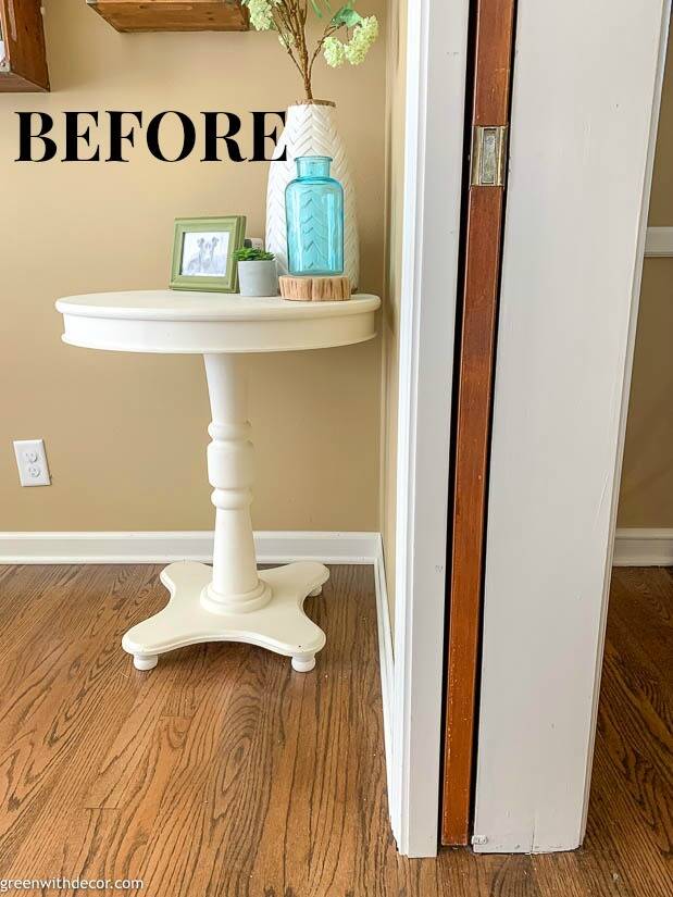 Wood pocket door surrounded by white trim