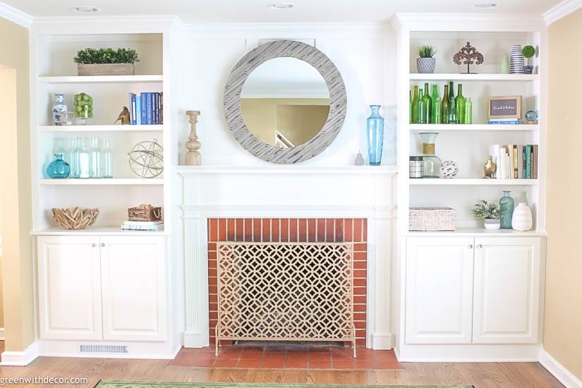 White decorated bookshelves with coastal pieces