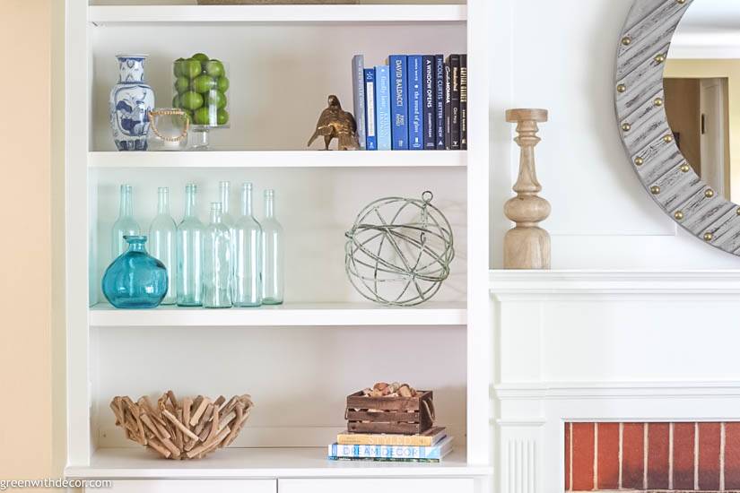 Bookshelf decorating ideas: wine bottles, books, a driftwood bowl and more!