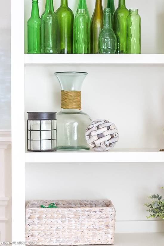 How to decorate bookshelves with aqua and green vases