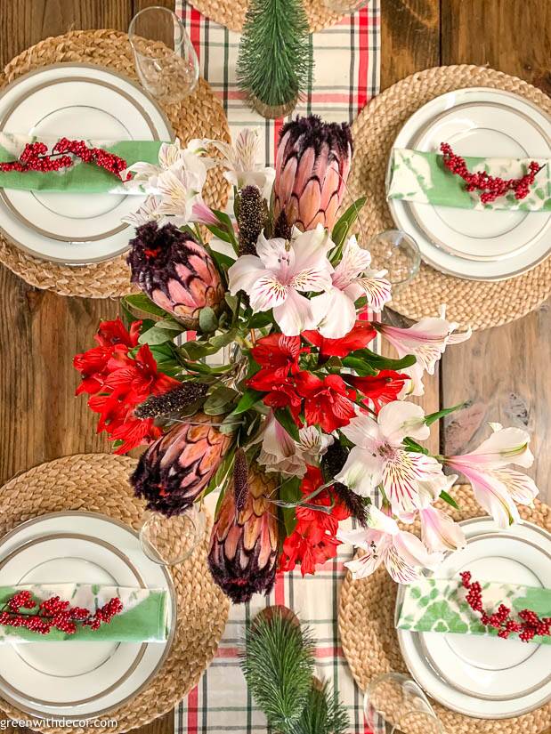 A Christmas centerpiece with red, white and pink flowers