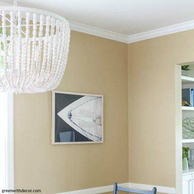 Coastal dining room with white bead chandelier