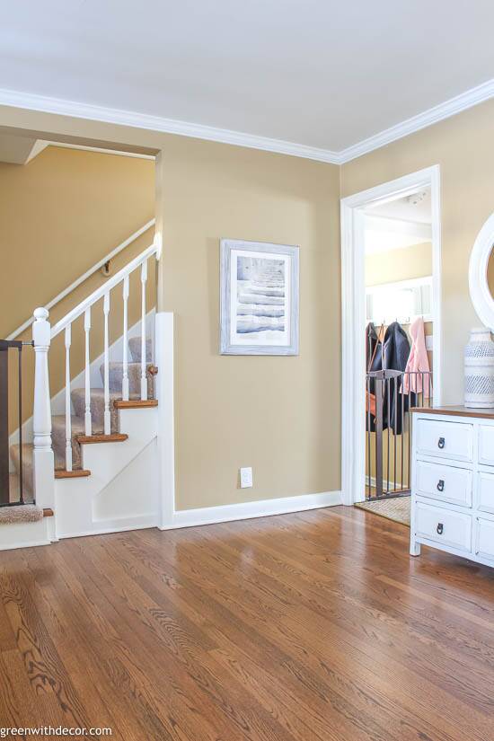 Small coastal foyer with stairs artwork