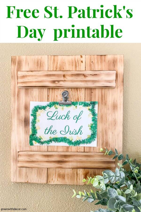 Free St. Patrick's Day printable clipped on a burned wood frame