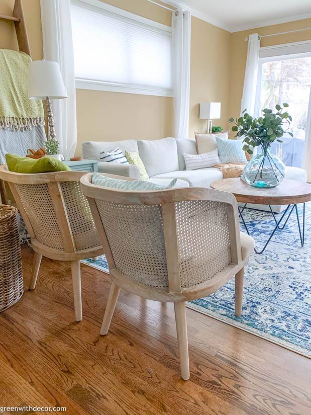 Neutral cane chairs in a coastal family room