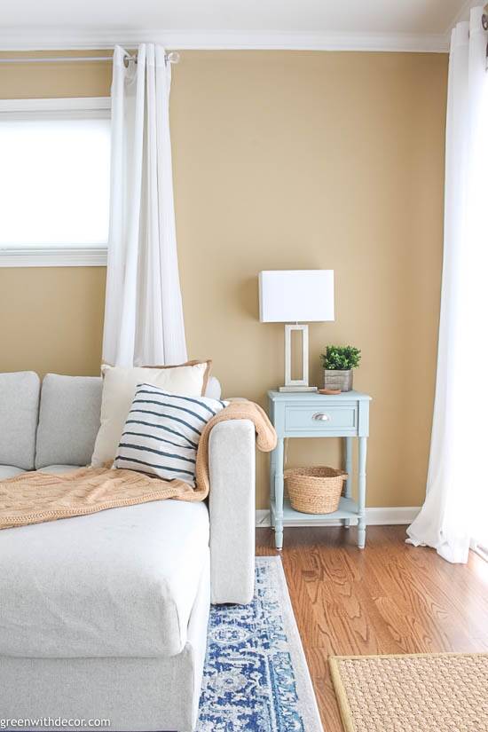 Blue end table in a coastal living room