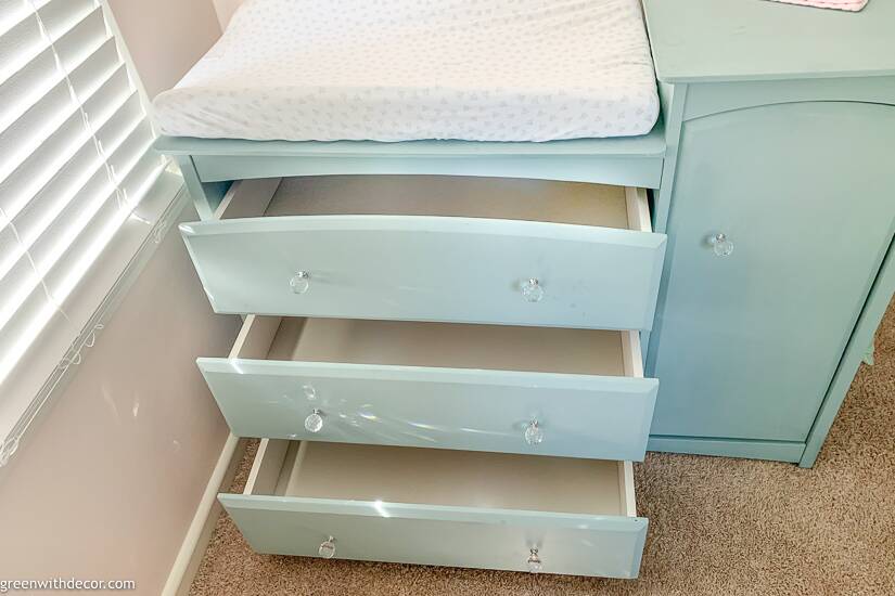 Blue dresser with empty drawers