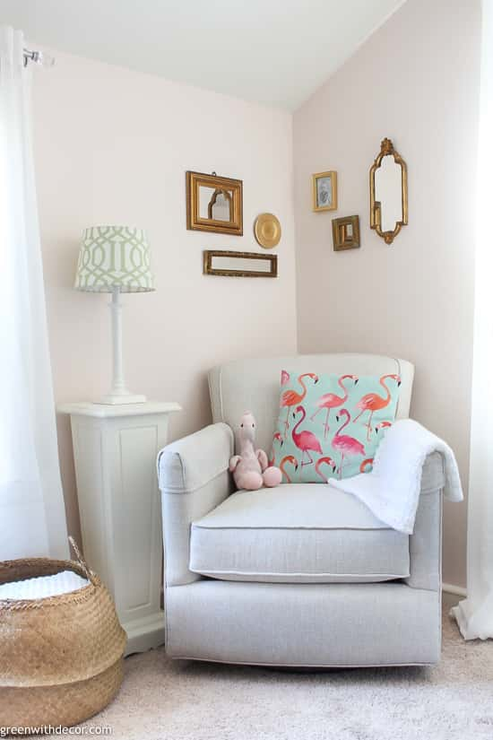 Gold mirror gallery wall in pink nursery