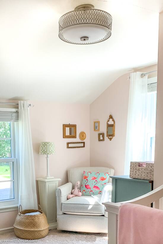 Pink girls nursery with silver light fixutre