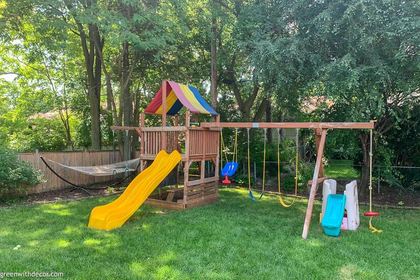 Swing set + hammock in green yard