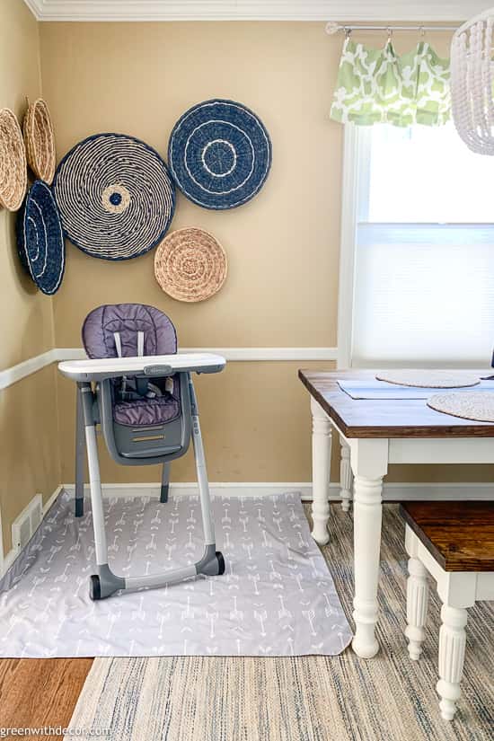 Dining room with rug and high chair mat