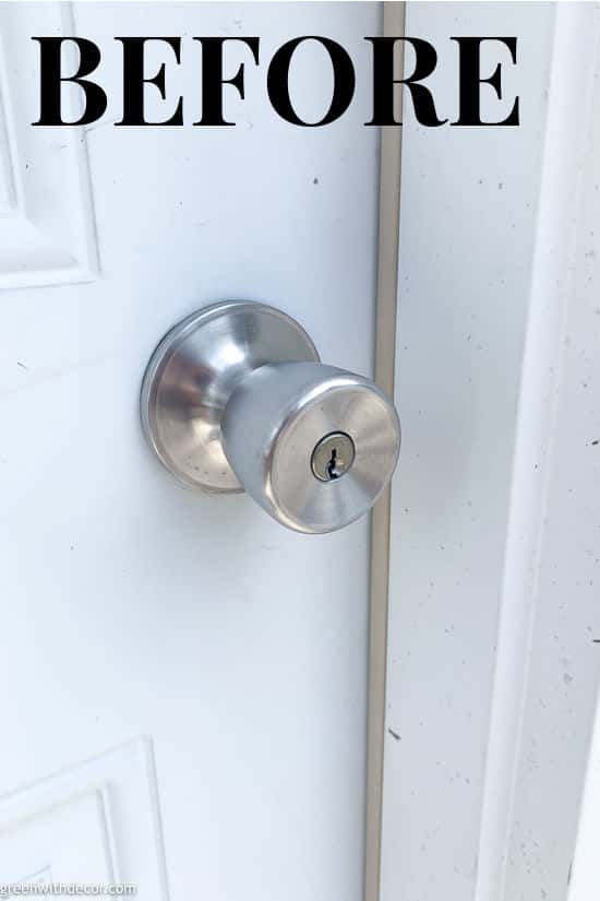 Old silver door knob before new door knob is installed