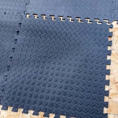 Black gym mat puzzle pieces for basement flooring