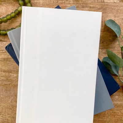 White book on wood coffee table