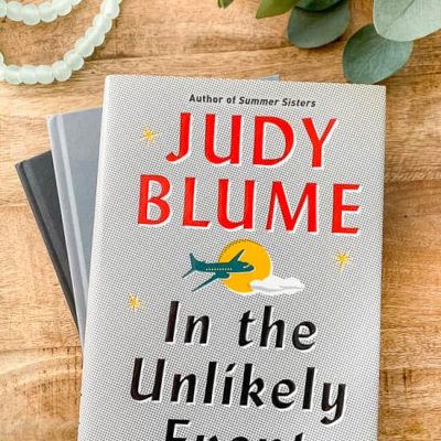 In the Unlikely Event by Judy Blume on wood coffee table