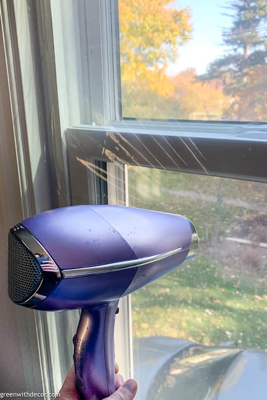 Using hair dryer with window insulation kit