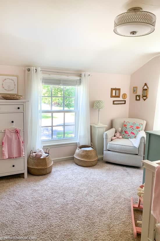Pink nursery with neutral furniture