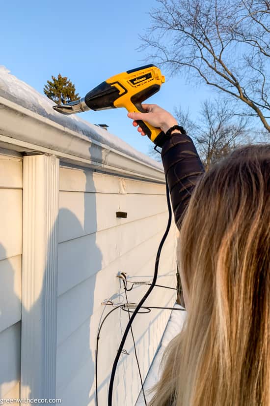 How to thaw downspouts to prevent ice dams using a heat gun