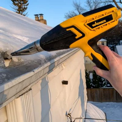 How to thaw downspouts to prevent ice dams - use a heat gun