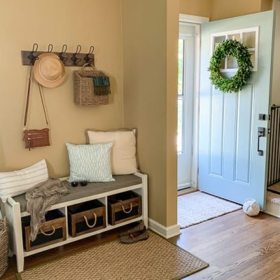 Small foyer with baskets, hooks and other smart storage