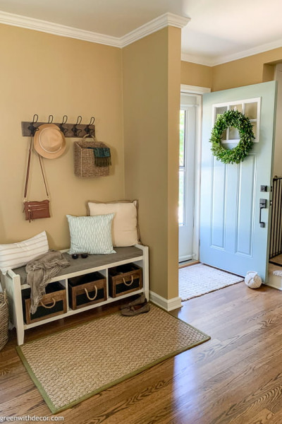 Small foyer with baskets, hooks and other smart storage